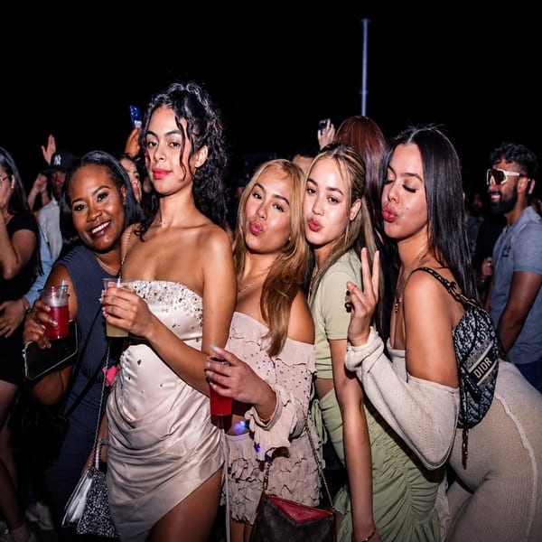Friends posing at a nighttime party